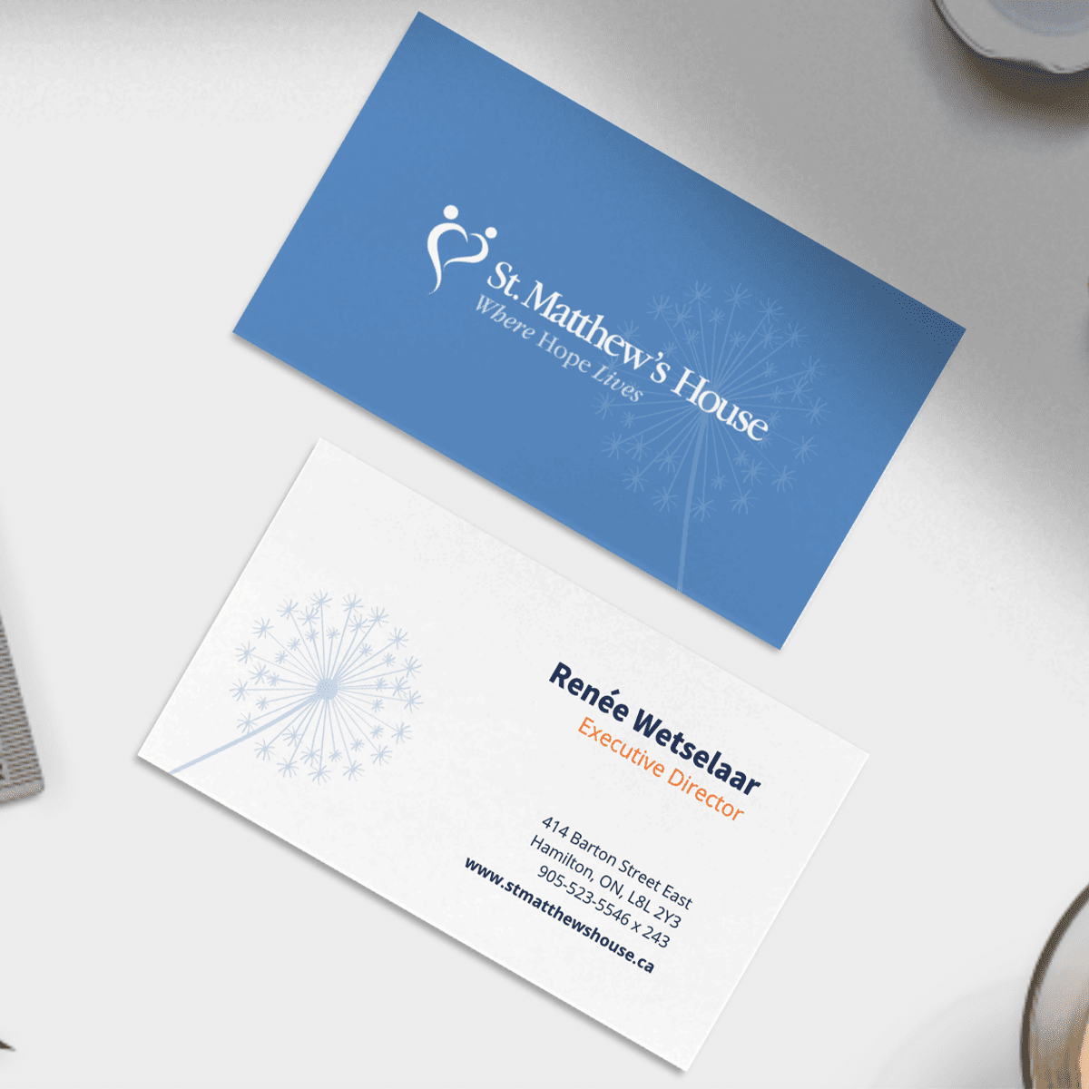 mock up of new business cards designed for St. Matthew's House